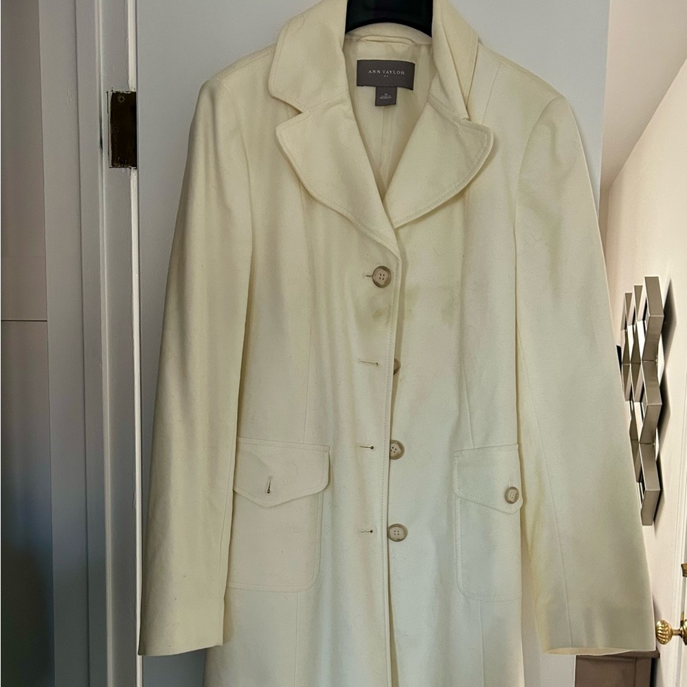 Woman’s light weight cream color coat